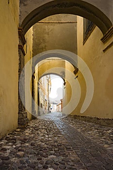 Narrow street with arcades in Comacchio, italy