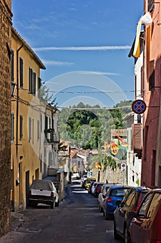 Narrow street of Asciano, Italy photo