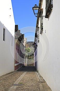 Narrow street and beautiful facades in Sanlucar de Barrameda, Cadiz photo