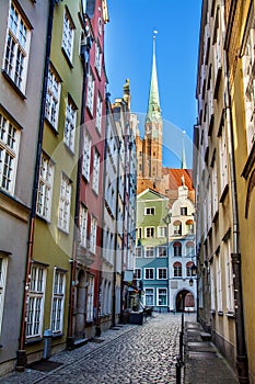 Narrow street and beautiful typical colorful houses buildings in old historical town centre, Gdansk, Poland