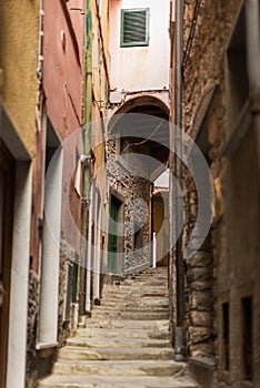 Narrow street with buildings in small colorful village Lerici in liguria, italy