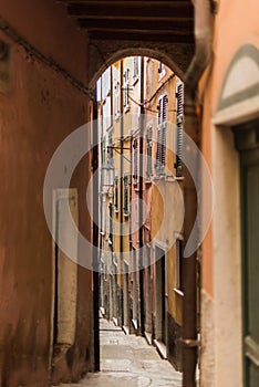 Narrow street with buildings in small colorful village Lerici in liguria, italy