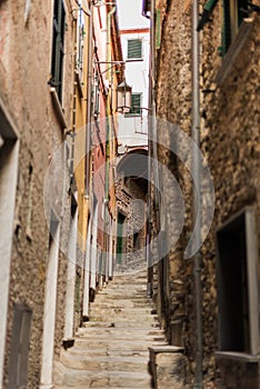 Narrow street with buildings in small colorful village Lerici in liguria, italy