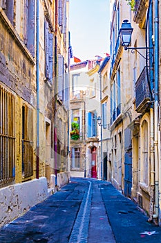 a narrow street in the center of Montpellier, France