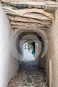 Narrow street in Chora town on Folegandros island. Cyclades, Greece