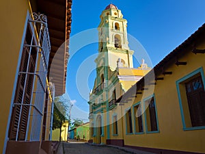 Narrow street and church in Trinidad, Cuba