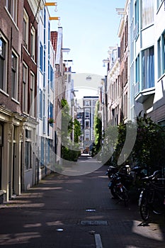 Narrow street in Netherlands , Amsterdam on a summer day