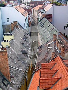 The narrow street of a European city. Multi-colored roofs of houses. View from above. Bratislava, Slovakia