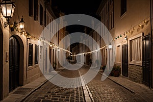 A narrow street in a european town lit by lanterns