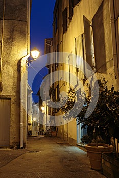 Narrow street with flowers in the old town Mougins in France. Ni