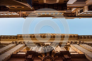 Narrow street and high buildings perspective view in Valetta