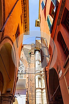 Narrow street lined with colorful buildings in Bologna historic center Italy