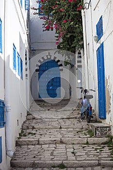 Narrow street with moped