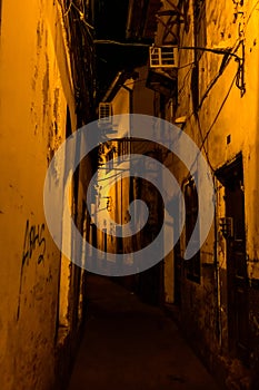 Narrow street at night in a Stone town. Zanzibar, Tanzania