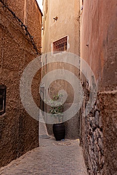 Narrow street in old district Medina in Marrakesh