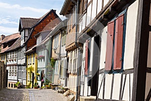 Narrow street of old houses with slightly skewed wall, Quedlinburg, Germany