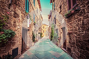 Narrow street in an old Italian town of Pienza. Tuscany, Italy. Vintage photo