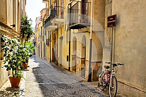 Narrow street in the old town of Cefalu, Sicily, Italy