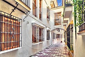 Narrow street in old town of Marbella photo