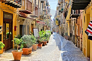 Narrow street in the old town of Cefalu, Sicily, Italy