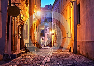 Narrow street of Old town with Night lantern lamps