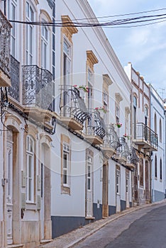 Narrow street of the old town at Portuguese town Tavira