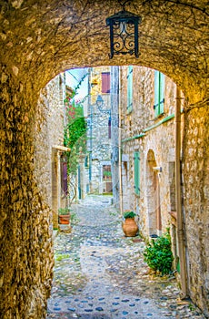 A narrow street in the old town of Saint Paul de Vence, France