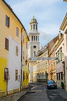 Narrow street in the old town of Sopron Templom utca street with an evangelic church at the very end in Hungary...IMAGE