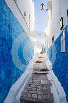 Narrow street with painted blue walls