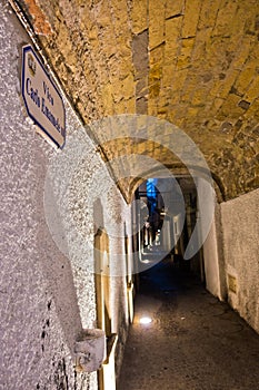 Narrow street passage at Carloforte harbor, San Pietro island, Sardinia