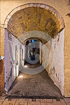 Narrow street passage at Carloforte harbor, San Pietro island, Sardinia