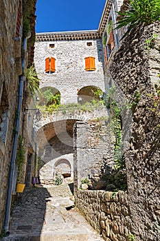 The narrow street in the picturesque village of Labeaume in the