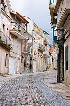 Narrow street in small european town. Mediavel buildings in Italy. ravel and summer tourism concept. Ancient architecture.