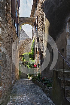 Narrow street in a small French village Vallon Pont d'Arc.