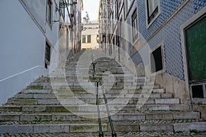 Narrow street with stairs in Lisbon, Portugal