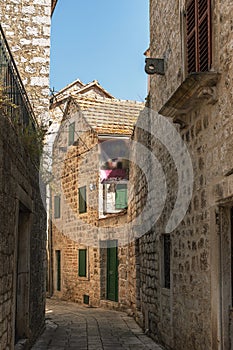 Narrow street of Stari Grad, Hvar island, Dalmatia, Croatia photo