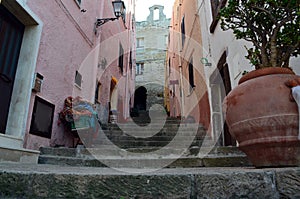 Narrow street with staris in Castelsardo fortress Italy