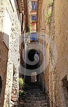 Narrow street with steps in medieval Saint Paul de Vence