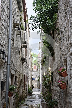 Narrow street with stone facades, in Ston, Dubrovnik Neretva county, located on the Peljesac peninsula, Croatia