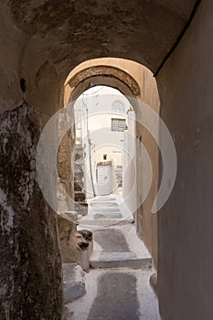 Narrow street in traditional Cycladic style Emporio village