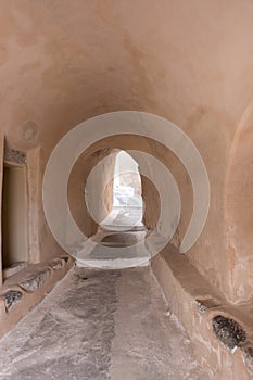 Narrow street in traditional Cycladic style Emporio village