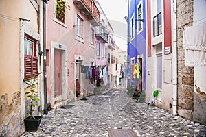 Narrow street at the traditional old district of Lisboa. Portugal photo