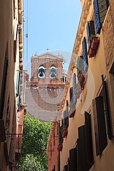 Narrow street with view to a chirch. Venice photo