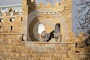Narrow streets of the old city, ancient buildings and walls. Baku, Azerbaijan anicient cannon photo