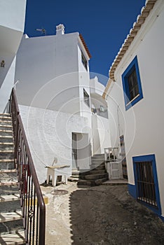 Narrow streets and painted white houses in burgau photo