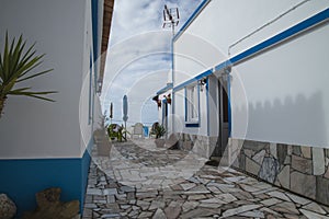 Narrow streets and painted white houses in burgau photo