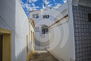 Narrow streets and painted white houses in burgau photo