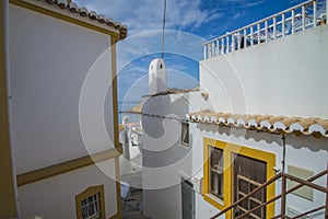 Narrow streets and painted white houses in burgau photo