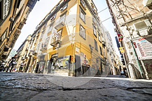 Narrow streets with small businesses in Naples, Italy