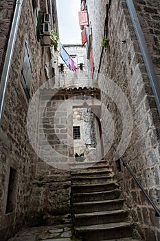 Narrow streets and stone stairs in old town of Kotor. Dwelling antidue houses. Montenegro